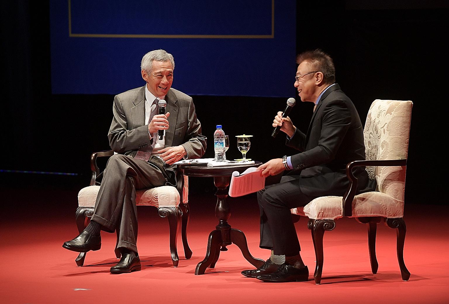 Prime Minister Lee Hsien Loong, seen here with Nikkei Asian Review's Mr Takehiko Koyanagi, speaking at a dialogue to mark the 50th anniversary of the Japanese Chamber of Commerce and Industry in Singapore.