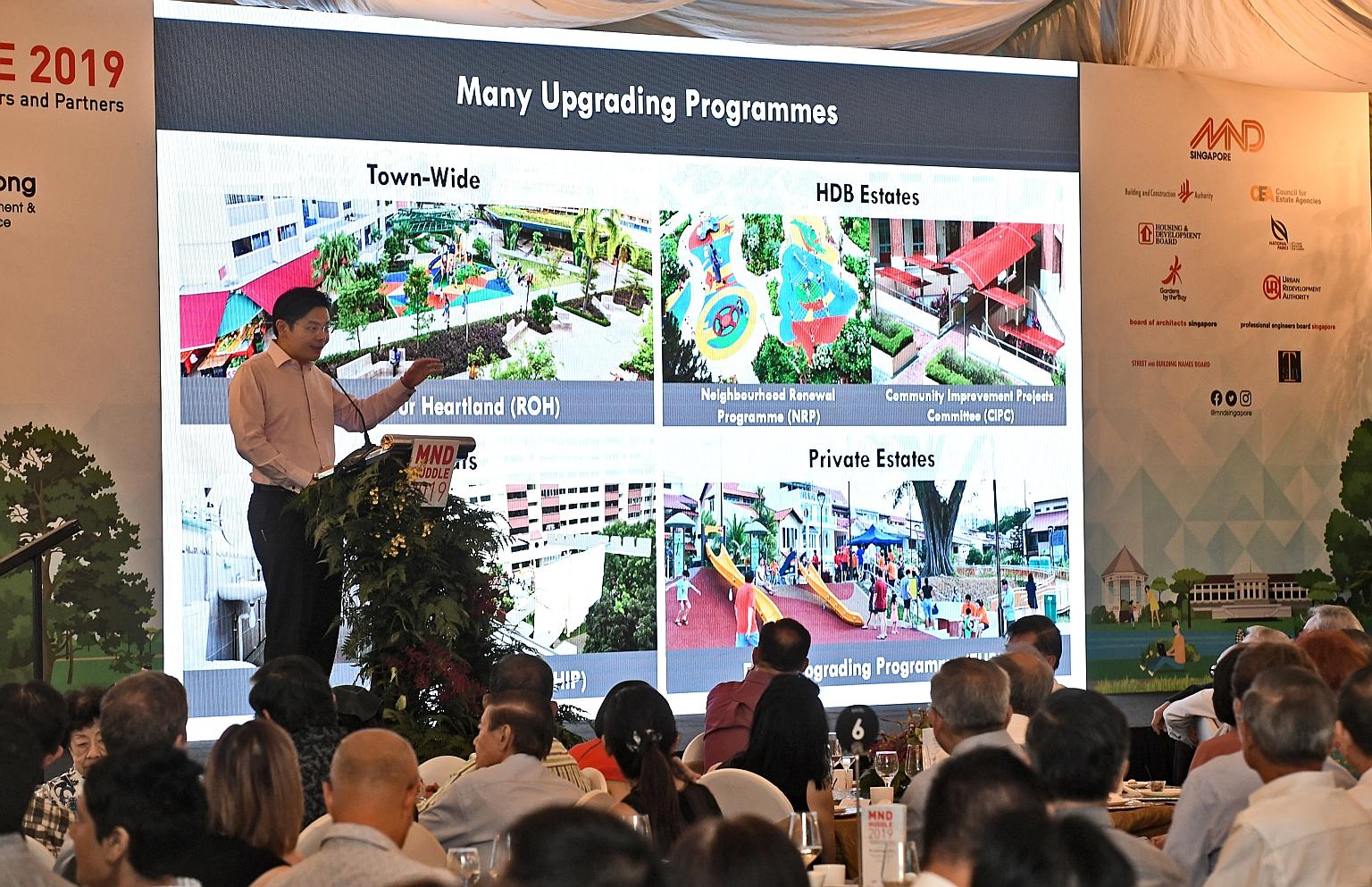 National Development Minister Lawrence Wong speaking at the annual MND Huddle yesterday at Fort Canning Park. He said the upgrading projects would also offer "a healthy pipeline of public sector projects", providing opportunities for consultants and 