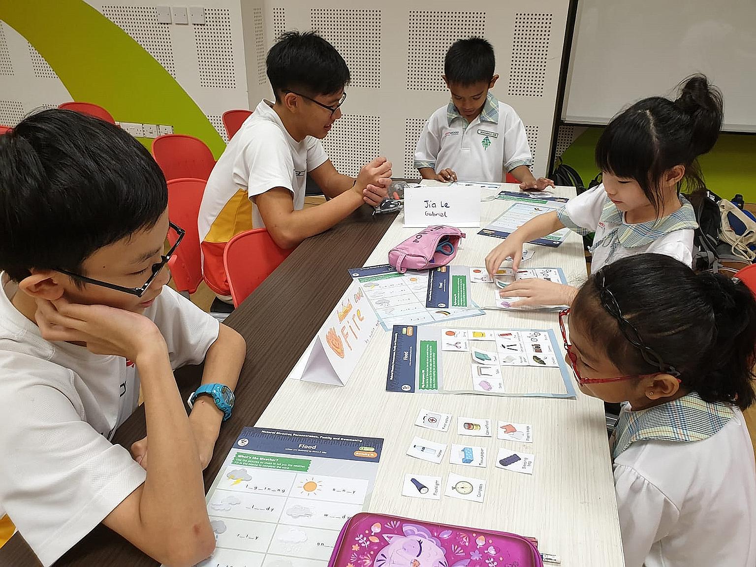 Primary 2 pupils from Westwood Primary with their buddies from Hwa Chong Institution earlier this year. The Young Student Programme, now in its seventh year, has benefited about 150 Westwood Primary pupils.