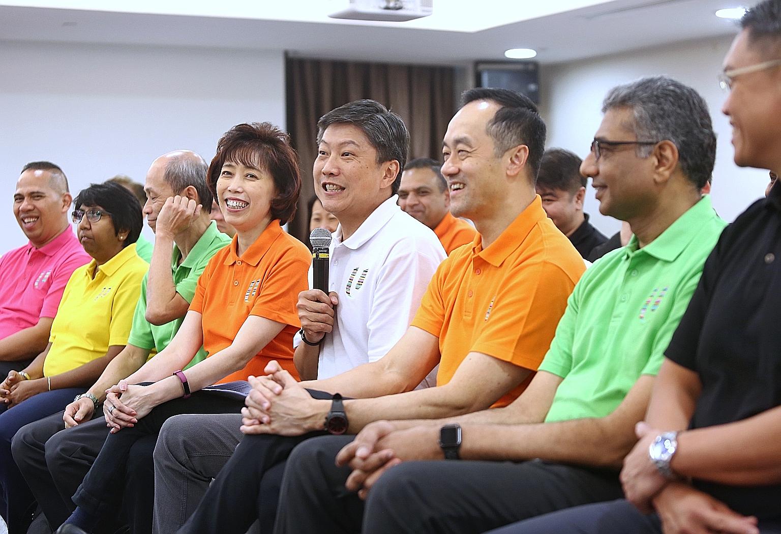 NTUC secretary-general Ng Chee Meng (in white) at a media briefing yesterday with the new NTUC central committee members. They are (from left) vice-presidents Abdul Samad Abdul Wahab, K. Thanaletchimi and Ong Hwee Liang; president Mary Liew; deputy s