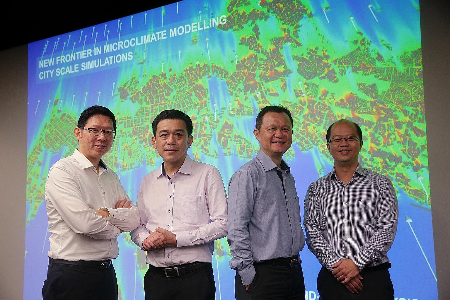 A*Star's Institute of High Performance Computing senior scientists Poh Hee Joo (third from far left) and Koh Wee Shing (far left) with other members of the team that won the President's Technology Award, Mr Tan Sze Tiong, director of the Housing Boar