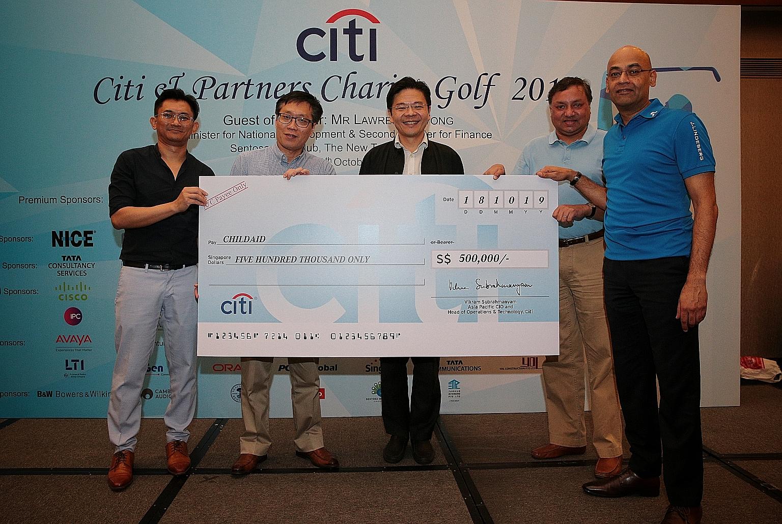 (From left) ChildAid 2019 co-chair Helmi Yusof, Business Times editor Wong Wei Kong, National Development Minister Lawrence Wong, Citi's chief information officer and head of operations and technology for Asia-Pacific Vikram Subrahmanyam and Citi's h