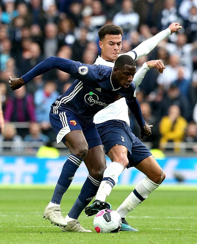 The two scorers, Dele Alli (in white) and Abdoulaye Doucoure, tussling for the ball. The Watford midfielder had got his side off to a flier in the sixth minute, before Alli equalised in the 86th minute to earn Tottenham a share of the spoils. 