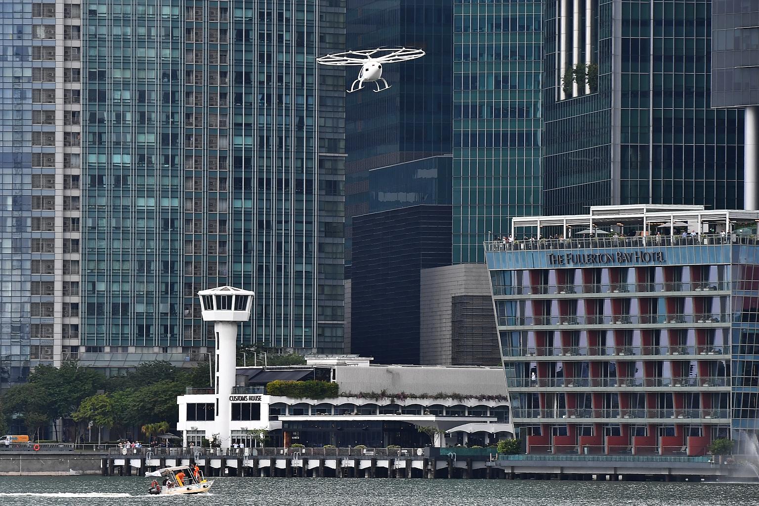 An 18-propeller drone-like flying taxi took to the skies here for the first time yesterday, as German firm Volocopter conducted a test flight of its vehicle around the Marina Bay district. The battery-operated, two-seater vehicle flew for about two m