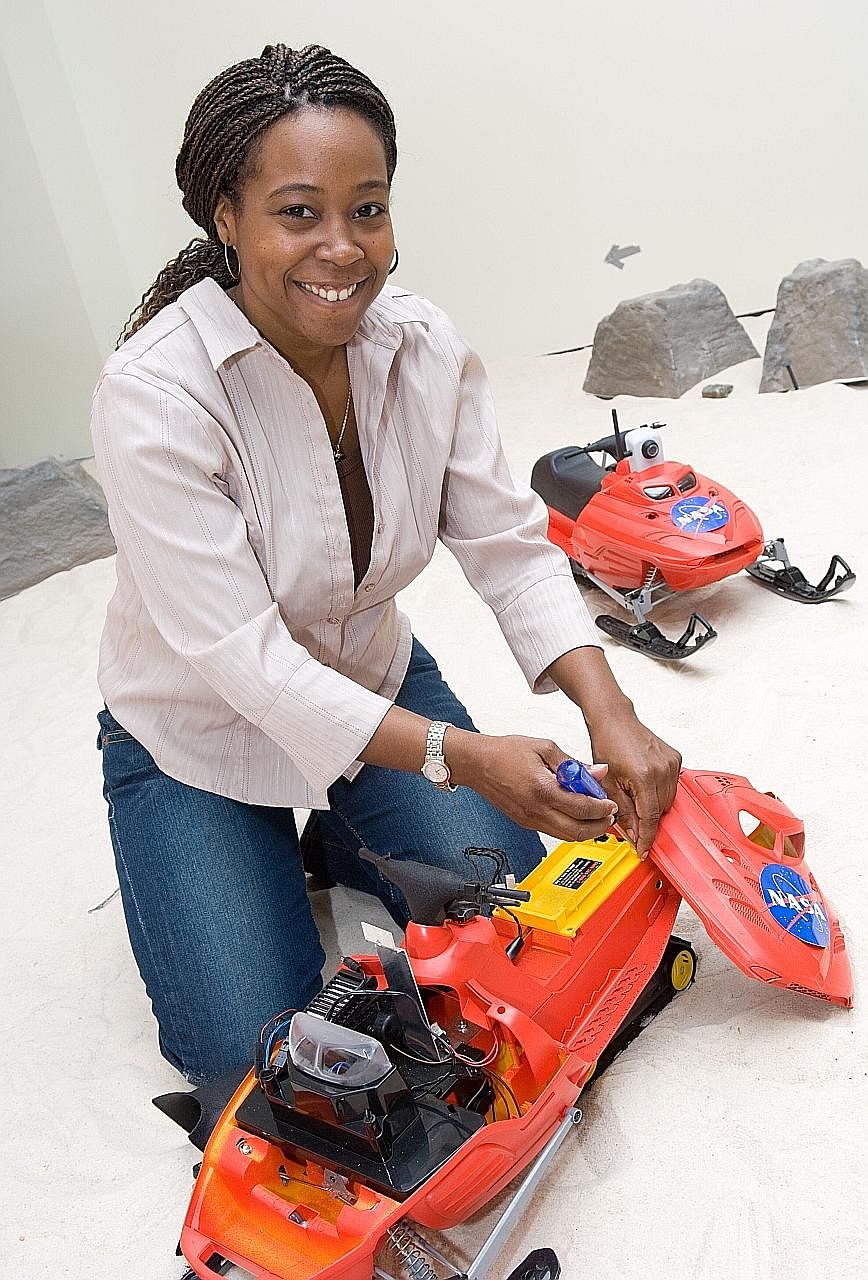 Dr Ayanna Howard, a professor and chair of interactive computing at Georgia Tech in the United States, with a robotic toy she and her team designed. The former Nasa researcher stresses the need to consider the human factor in the testing of self-driv