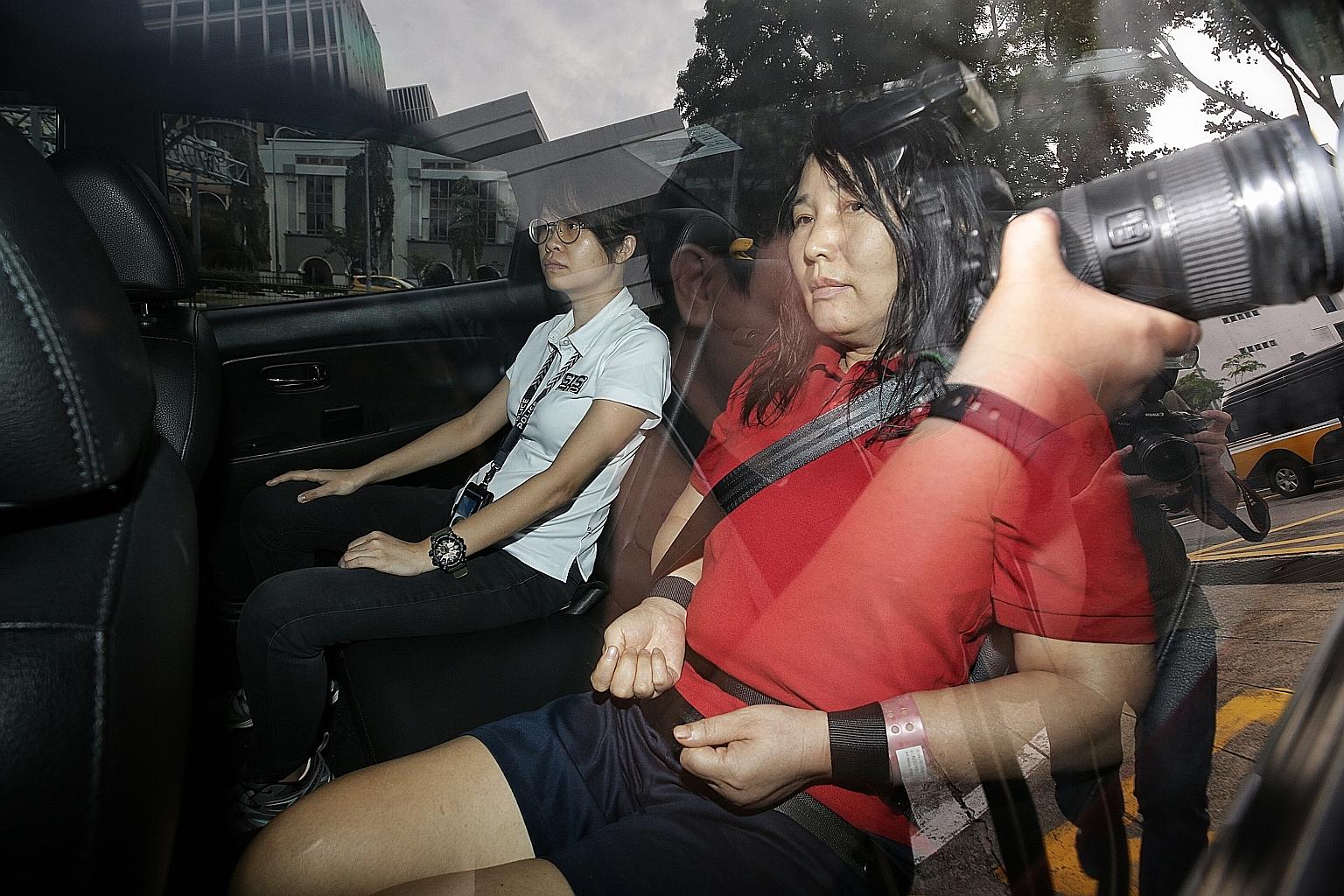 Chinese national Wang Shuzhen arriving at the State Courts yesterday. According to housing records, the Ang Mo Kio Avenue 6 flat where the murder took place was owned by the victim, Mr Teh Hock Pine. ST PHOTO: KEVIN LIM