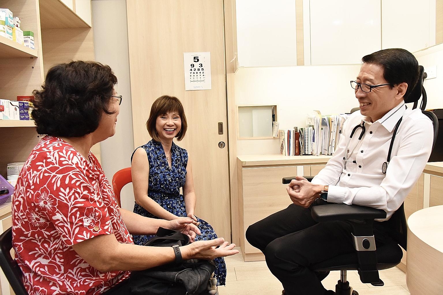 Dr Lim Chien Chuan, general practitioner at Sims Drive Medical Clinic, conducting a clinical consultation yesterday for diabetic patient Annie Goh, with Senior Minister of State for Health Amy Khor sitting in. PHOTO: LIANHE ZAOBAO
