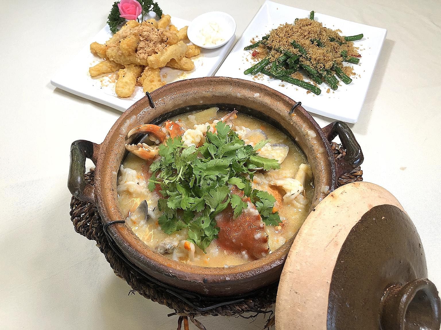 Clockwise from top left: Golden Huai Shan, French Beans with Shrimp and Seafood Claypot Porridge.