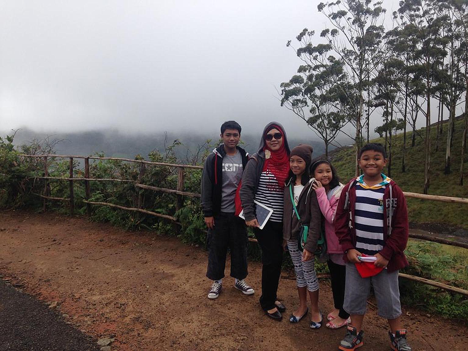 Madam Nur Azah Ismail with her four children (from left): Izz Amsyar, Iffah Irdina, Ilya Insyirah and Irfan Afiq, in Munnar, a town in India's Kerala state. The family lived in Chennai for about two years because of their father's work posting.
