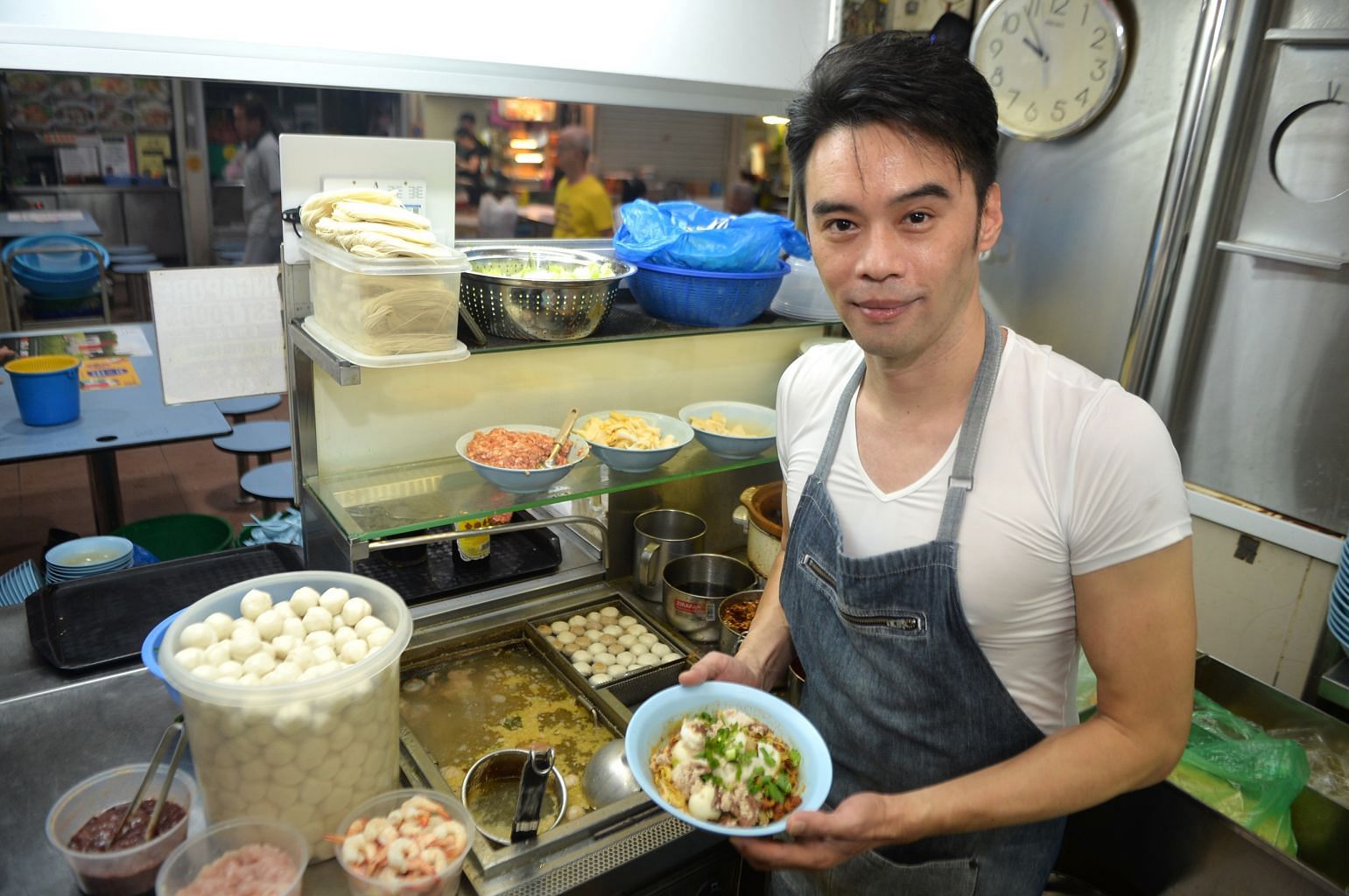 Noodle seller Gilbert Lim gets customers hitting on him even though he is married and a father.