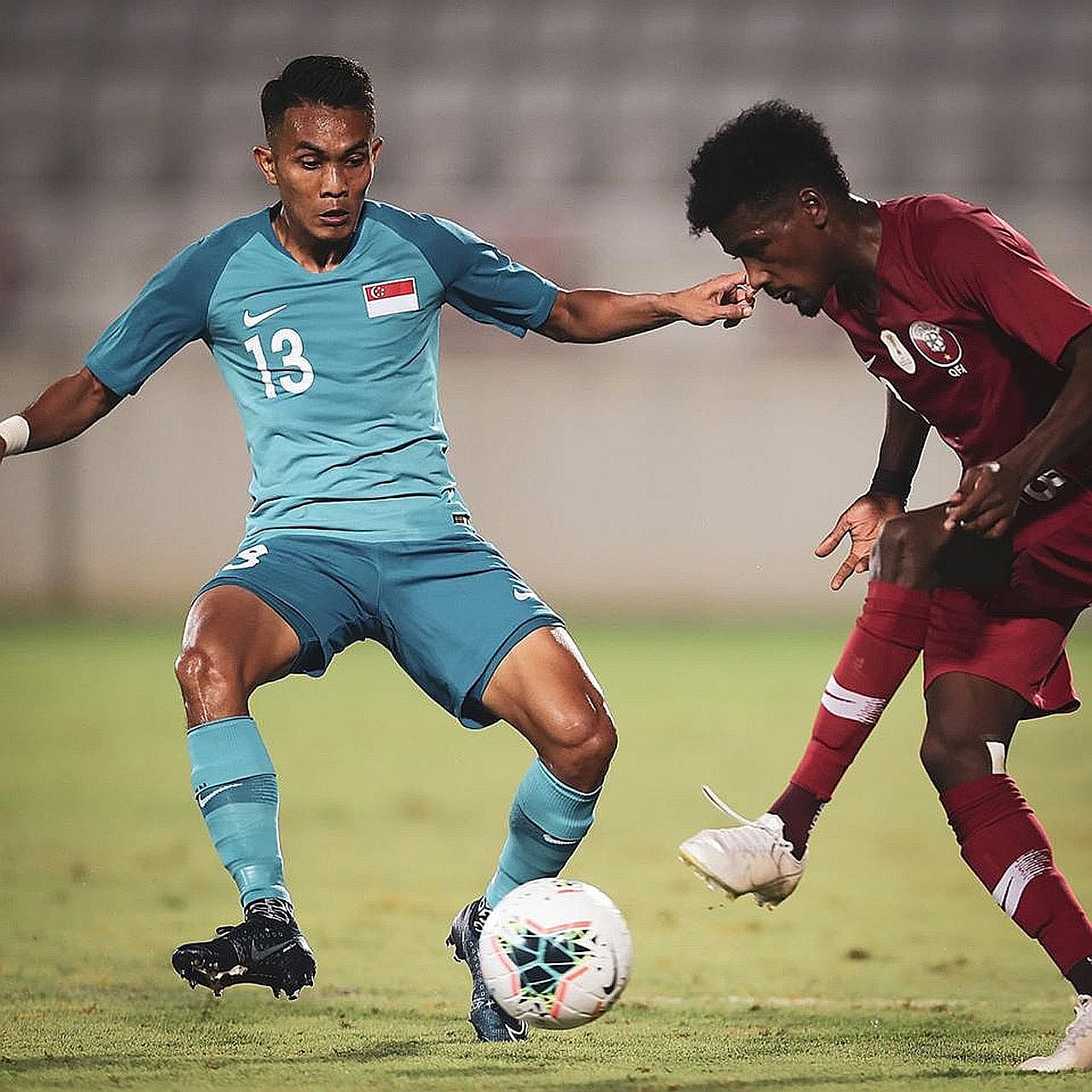Hafiz Nor marking a Qatari player in last Thursday's 2-0 friendly loss in Doha. He is in line for his third straight Lions start against Yemen today. PHOTO: QATAR FA