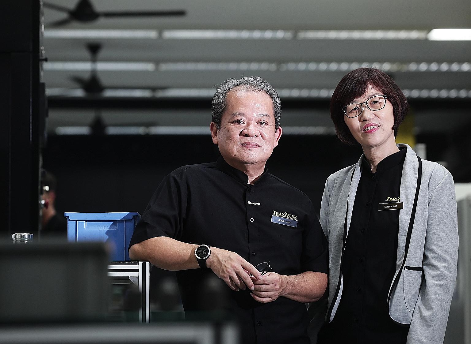TranZplus general manager Simon Lim and finance manager Serene Tan. The senior employees went through professional conversion programmes to be equipped with skills for the manufacturing sector.
