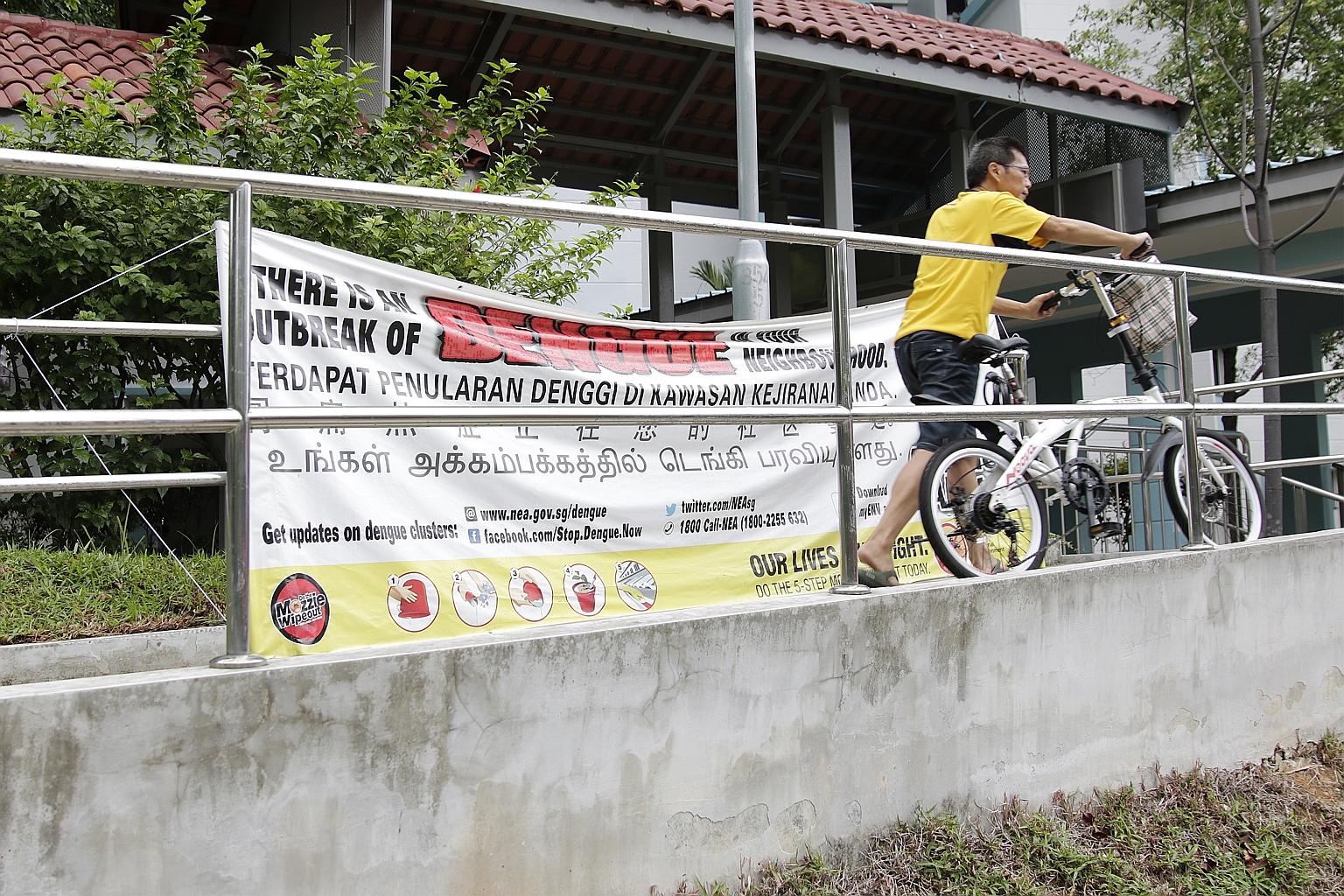 A dengue outbreak awareness banner in Ang Mo Kio. The National Environment Agency's advisory comes as the number of dengue cases so far this year has risen more than five times from the same period last year.