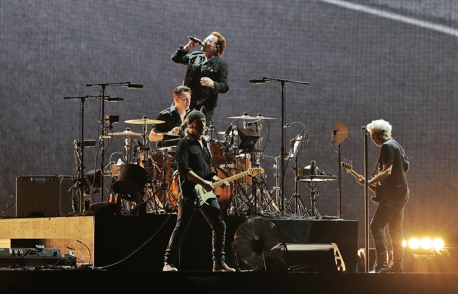 Irish rock band U2 comprising (from left) drummer Larry Mullen, guitarist The Edge, frontman Bono and bassist Adam Clayton performing at the National Stadium to a 50,000-strong sold-out crowd yesterday.
