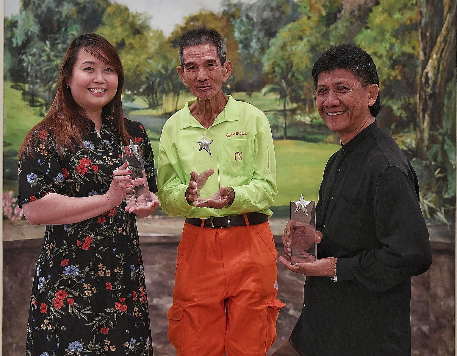 Among the recipients of the Environmental Services Star Award were (from far left) Ms Regina Cheah, an advocate for sustainability practices; Mr Low Kum Chuen, who has been actively helping his new colleagues adjust to their work in Ang Mo Kio Garden