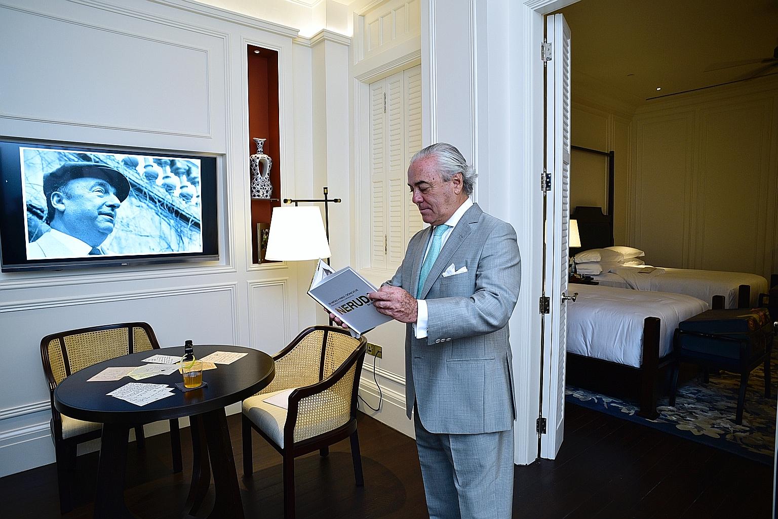 Chilean Ambassador James Sinclair reading one of the books, From Neftali To Pablo, Chronicles Of Neruda In Singapore, in Raffles Hotel's Pablo Neruda Suite - named after the famous poet and former consul of Chile.