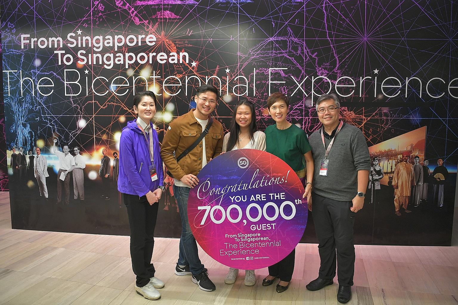 (From left) Mr Gene Tan, executive director of the Singapore Bicentennial Office; Mr Roger Lim, the Bicentennial Experience's 700,000th visitor, and his girlfriend Michelle Liew; Manpower Minister Josephine Teo, who is also co-chairman of the ministe