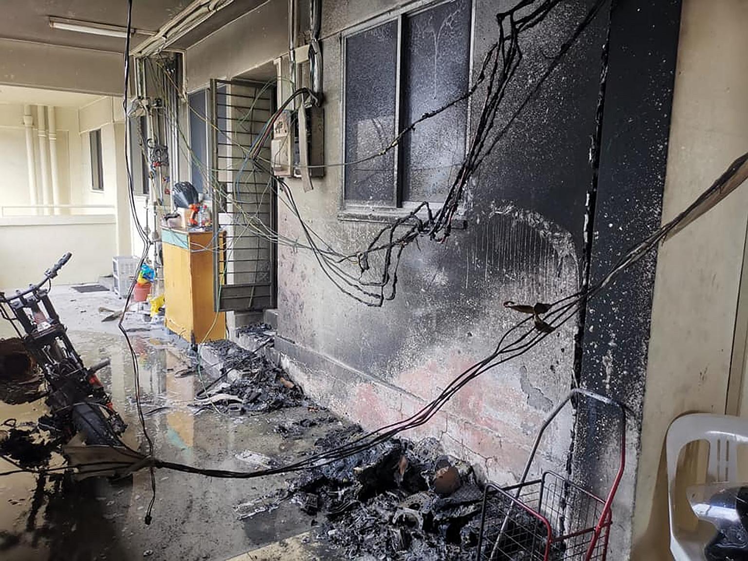 A personal mobility device left charging in the common corridor of Block 715 Clementi West Street 2 resulted in a fire on Dec 5 that led to three residents being evacuated. PHOTO: SCDF/FACEBOOK