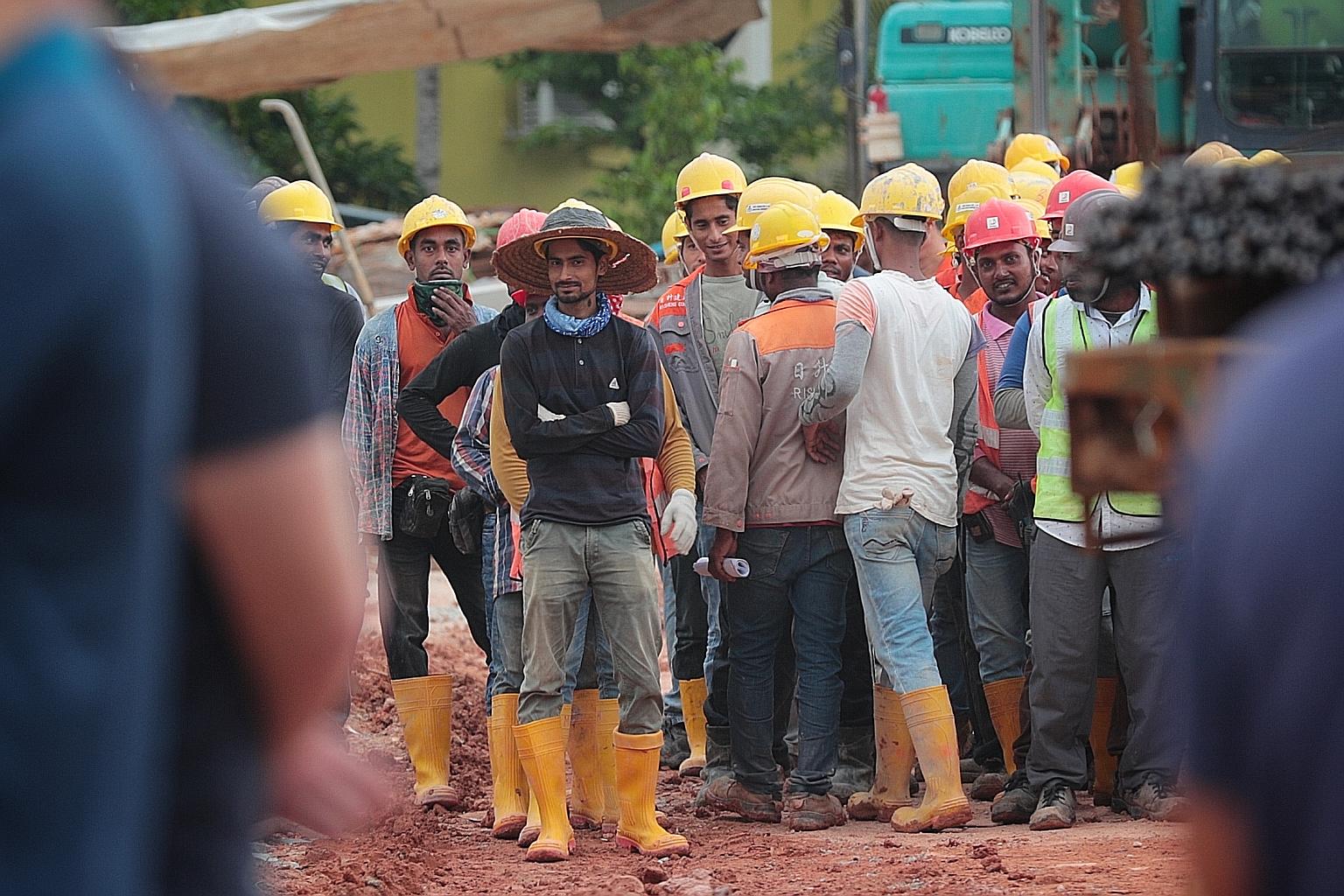 Sixty per cent of those surveyed here felt that migrant workers should not receive the same pay benefits as local workers, the highest share out of the four nations surveyed. ST PHOTO: JASON QUAH