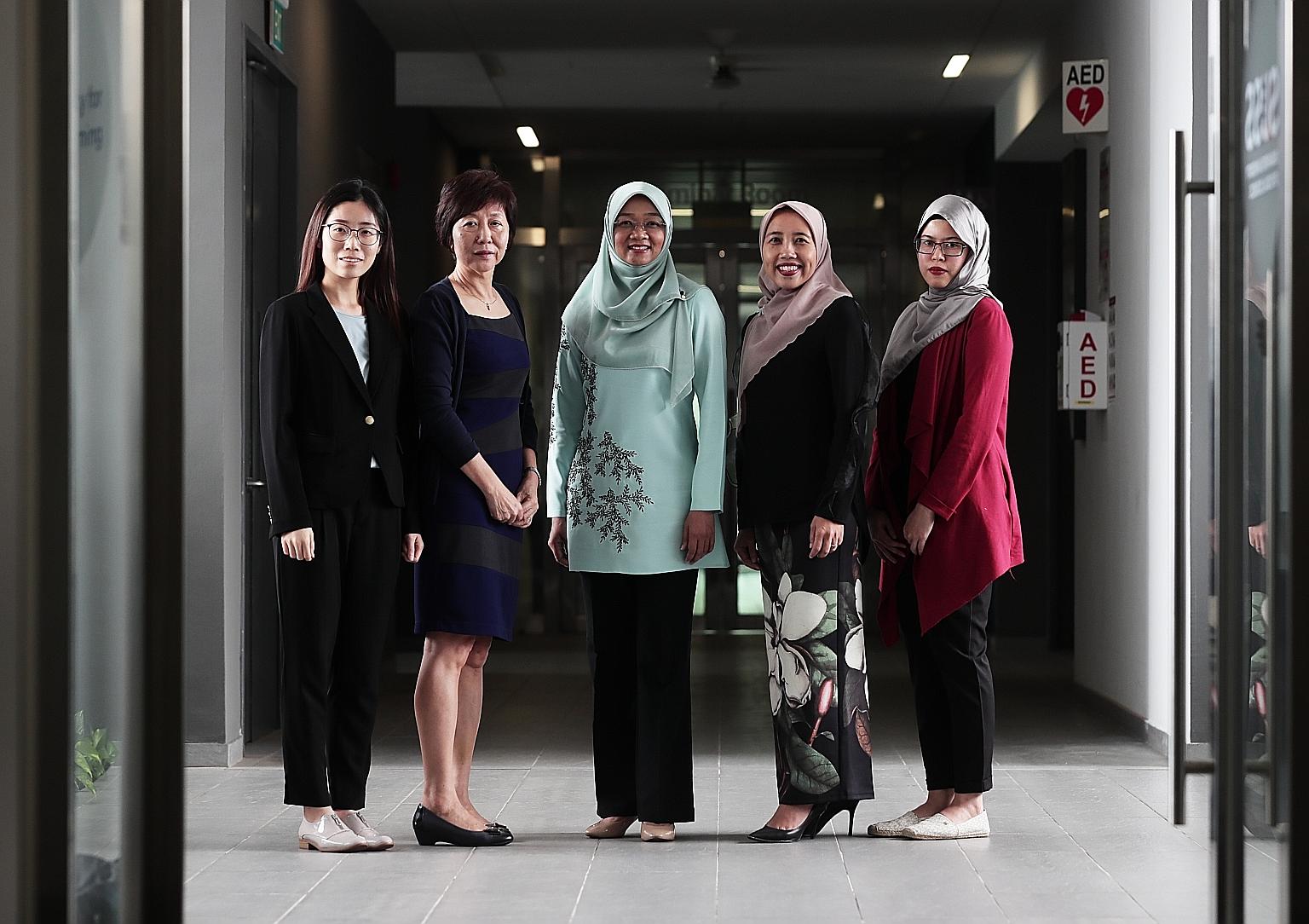 (From far left) Ms Li Jizhi, research assistant at SUSS' Business Intelligence and Analytics unit; Associate Professor Sylvia Chong, project lead of the unit; Mendaki chief executive Rahayu Buang; Mendaki deputy chief executive Aidaroyani Adam; and M