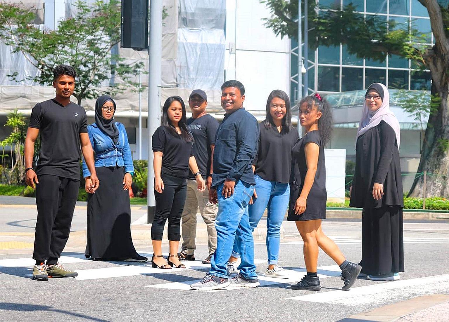 Mr Zakir Hossain Khokan (centre), founder of literary interest group Migrant Writers of Singapore, with performers at a rehearsal of Zebra Crossing. The poetic play, written and performed by migrant workers, was part of the festival yesterday.