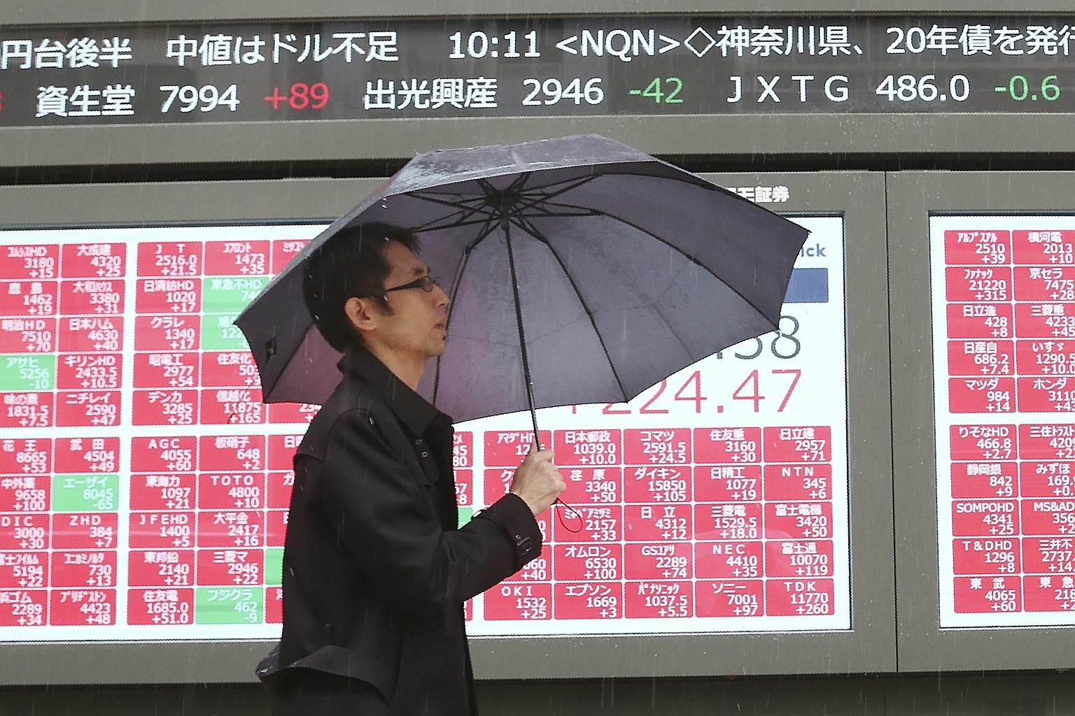 An electronic stock board of a securities firm in Tokyo in December. Except for Malaysia, which ended the year in the red, the rest of Asia's share markets stayed in the black after hopes of a United States-China trade war truce helped erase losses i