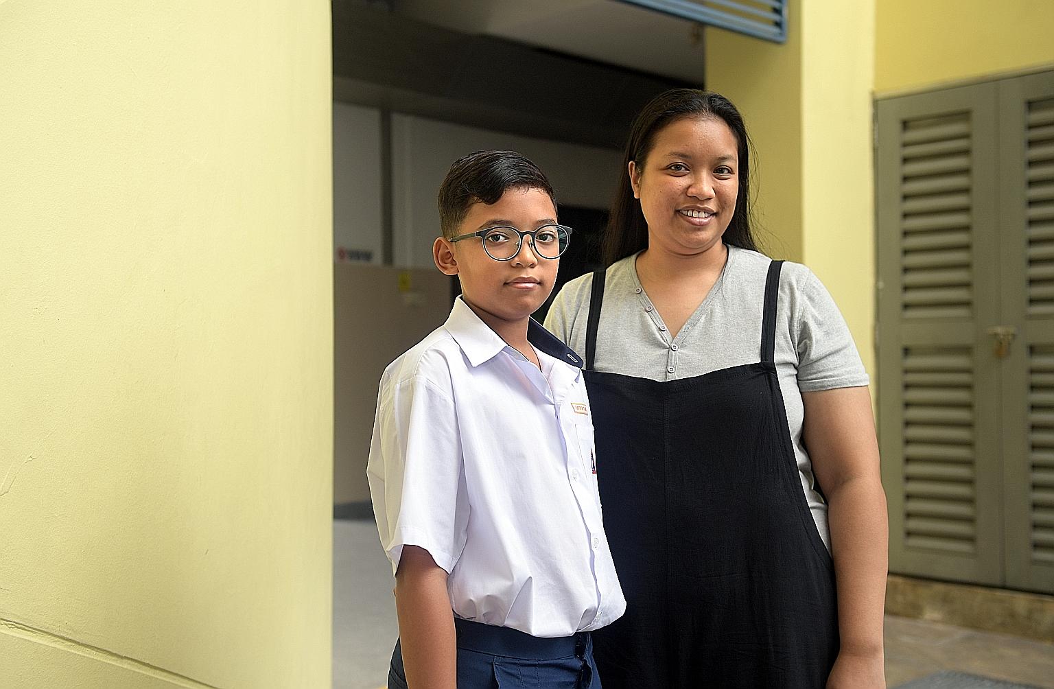 Teck Ghee CCC Bursary recipient Muhammad Hayden Dany Osman with his mother Nur Farhana Abu Bakar at the award ceremony yesterday. ST PHOTO: ALPHONSUS CHERN