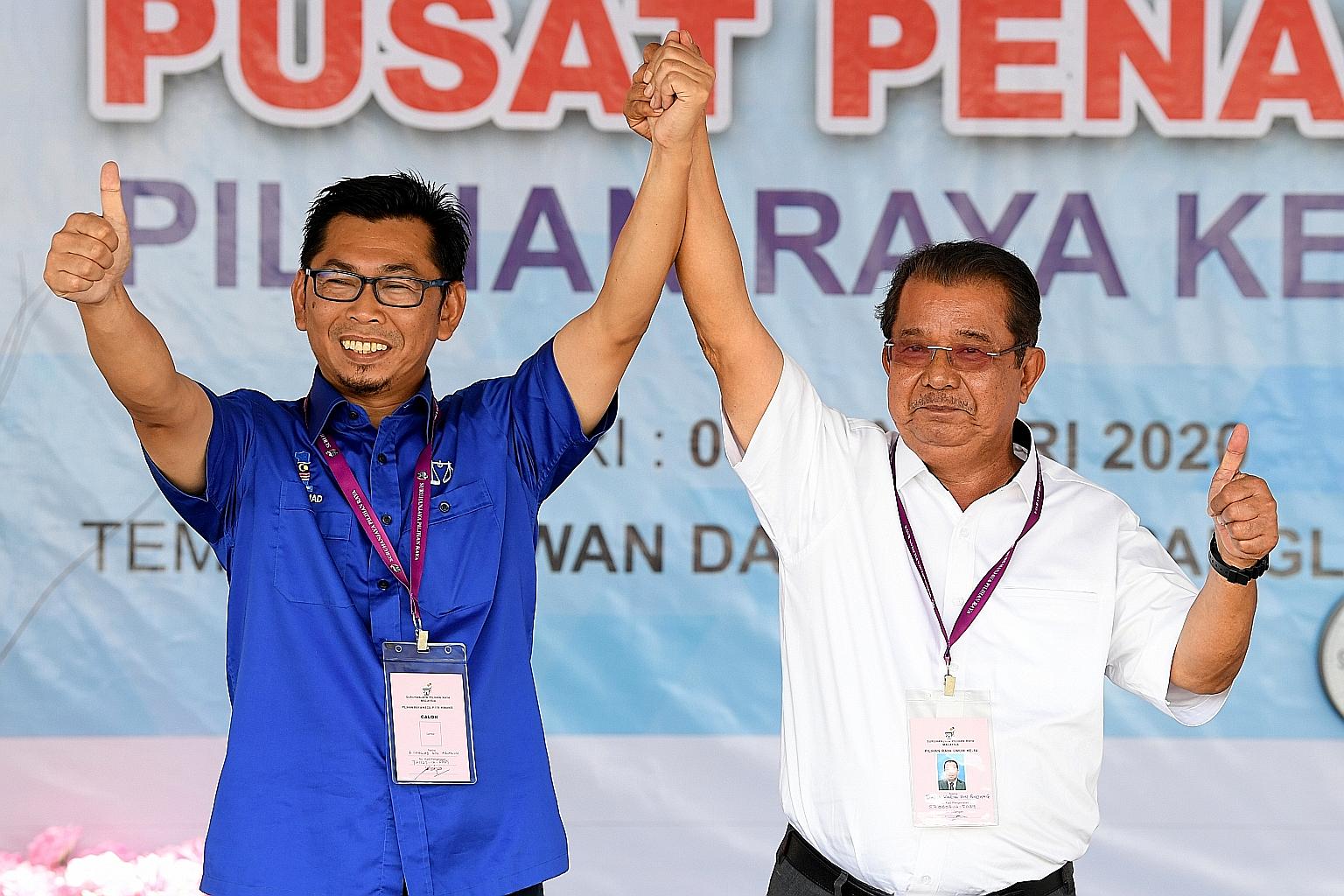 Datuk Mohamad Alamin (left) from Barisan Nasional and Parti Warisan Sabah's Datuk Karim Bujang at the nomination centre in Beaufort, Sabah, yesterday.