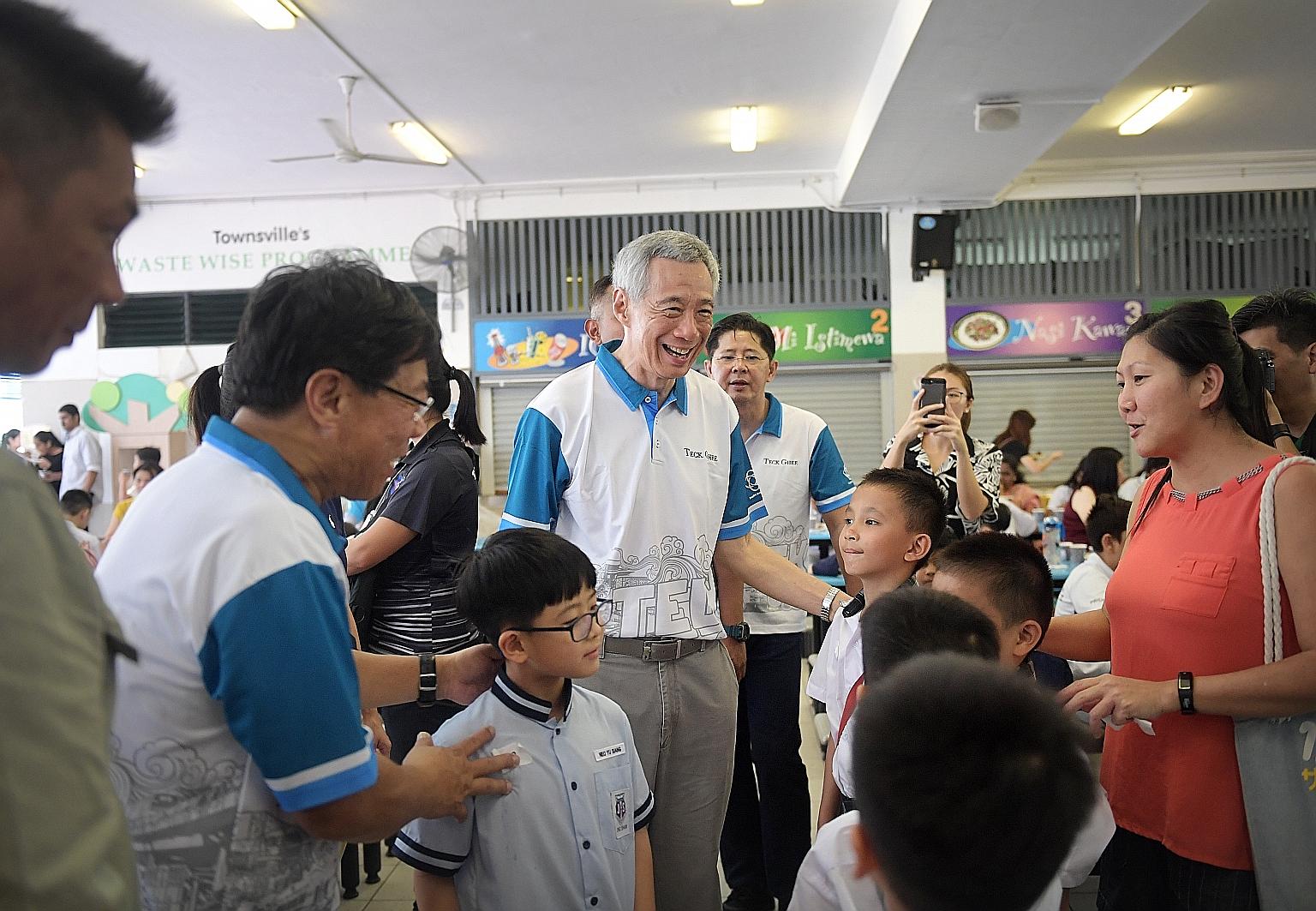 Prime Minister Lee Hsien Loong meeting award recipients and their families at the award ceremony on Saturday at Townsville Primary School. The Teck Ghee CCC Bursary was awarded to 351 students, while another 760 received the MOE Edusave Awards.