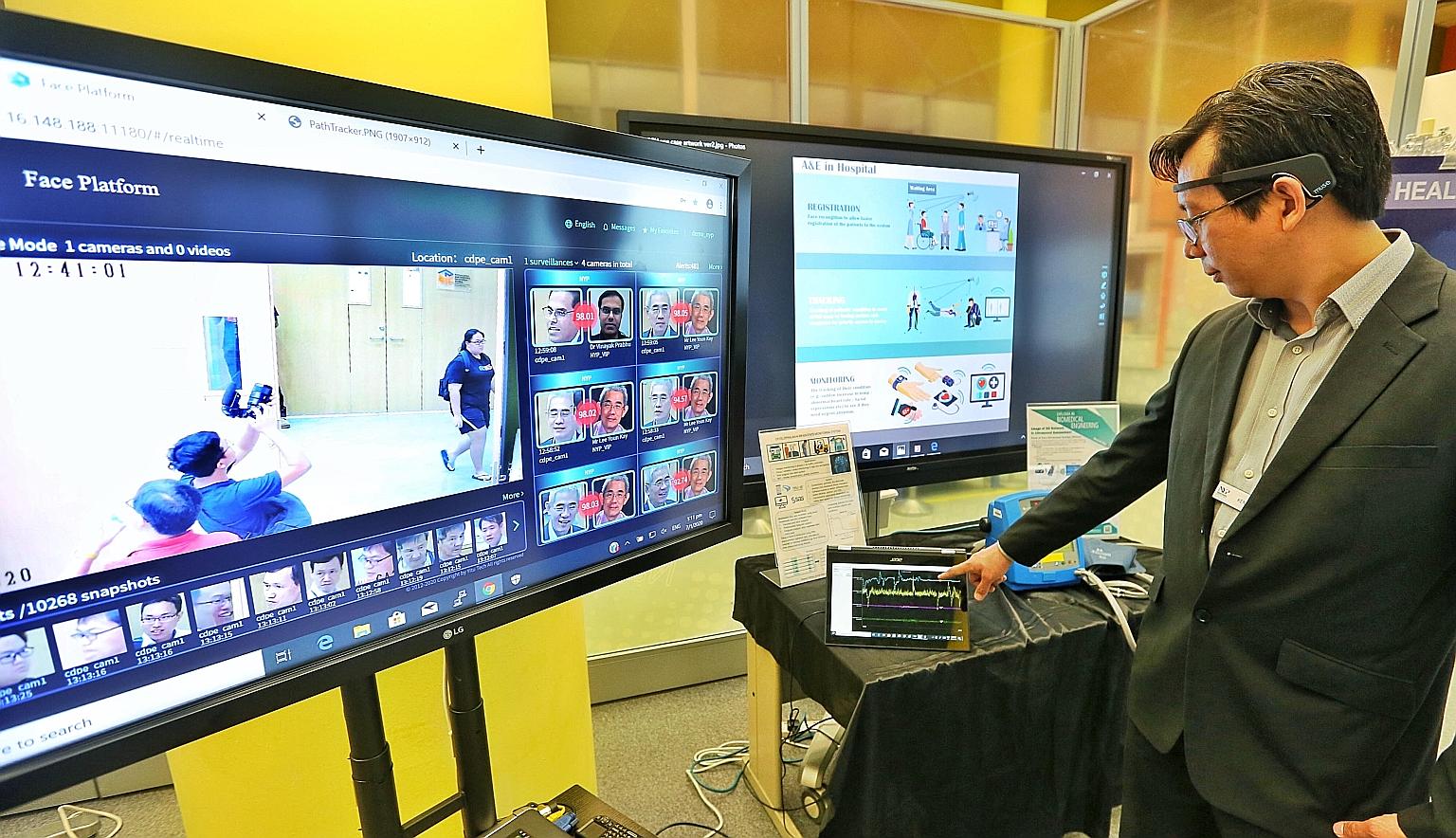Mr Kent Loo, deputy manager at Nanyang Polytechnic School of Engineering's Centre for Digital and Precision Engineering, demonstrates the use of a smart sensor that can monitor the brain waves of emergency patients to ascertain if they are stressed o