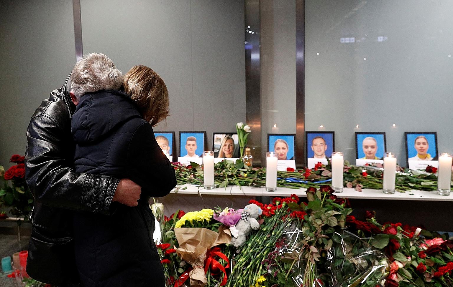 Relatives of the flight crew of the plane that crashed in Iran, mourning at a memorial at the Boryspil International Airport outside Kiev, Ukraine, on Wednesday. PHOTO: REUTERS