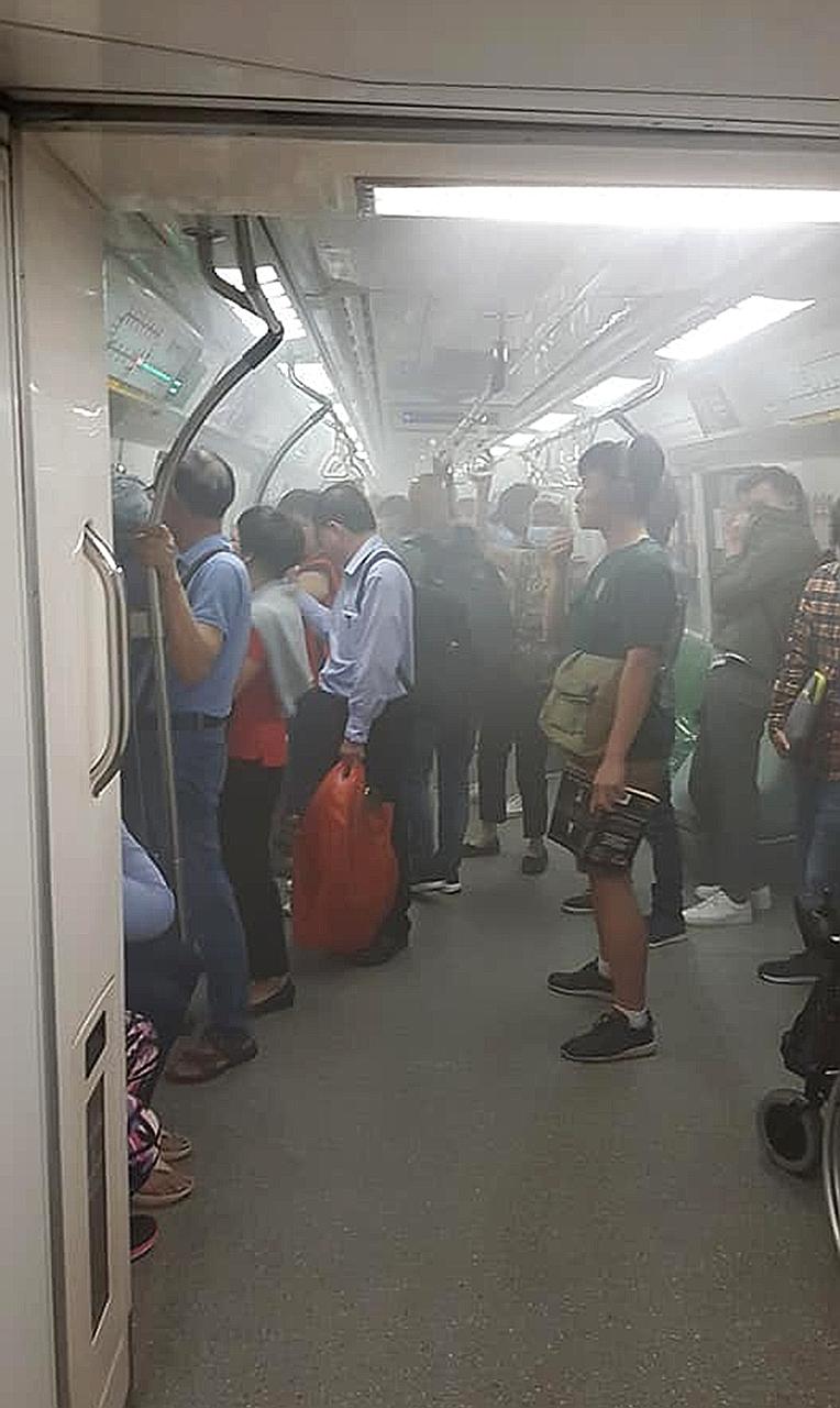 White smoke inside the cabin of the MRT train at Tanjong Pagar yesterday.