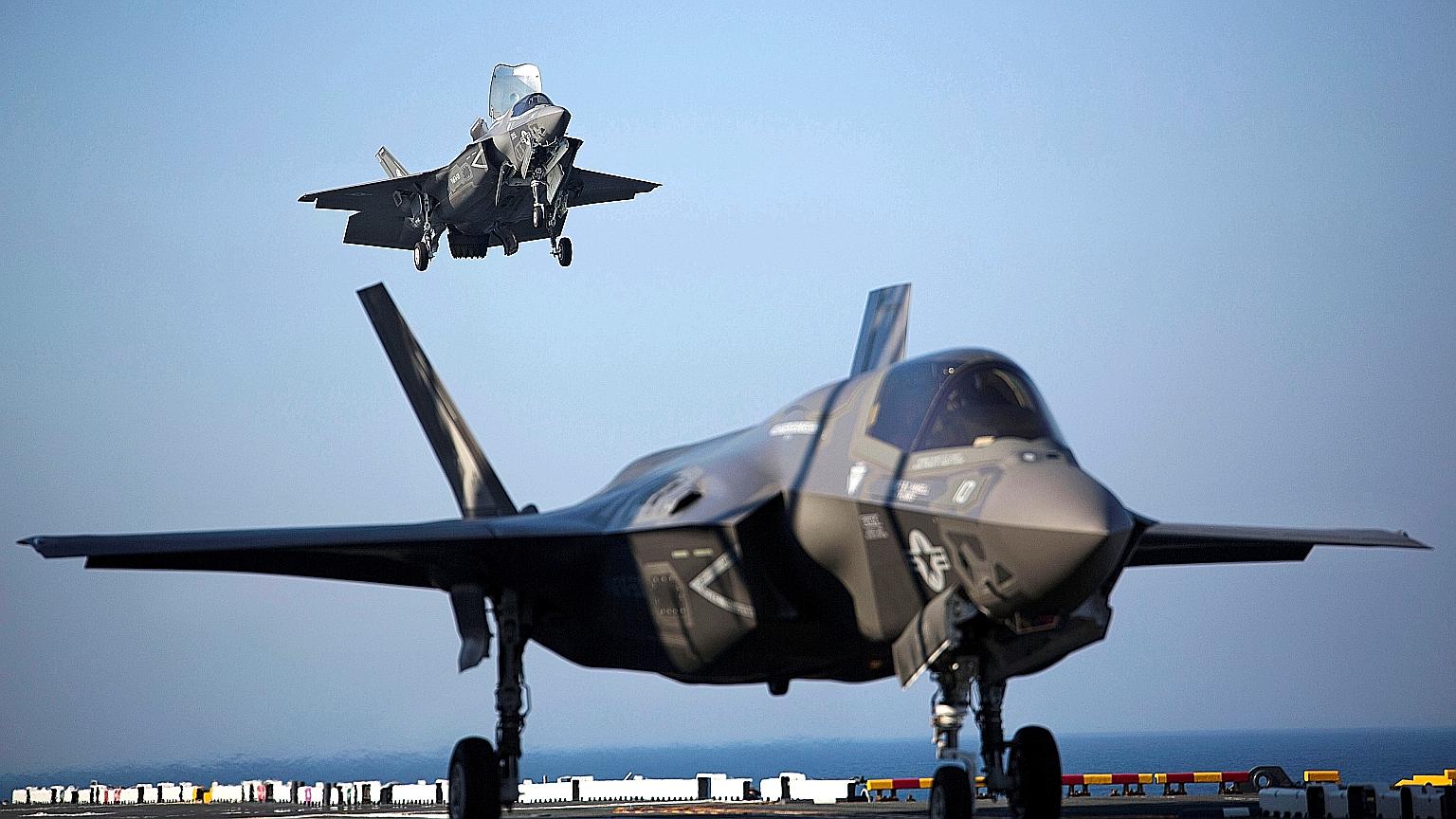 The F-35B jets (left), which can take off from shorter runways and land vertically, are meant to replace Singapore's ageing F-16 fleet, which has been in service since 1998. PHOTO: REUTERS