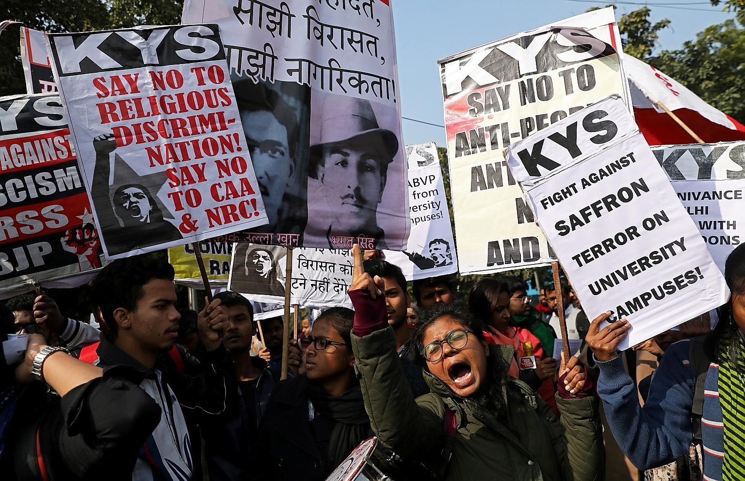 Demonstrators carrying placards and shouting slogans during a protest march on Thursday against the Jawaharlal Nehru University attacks.