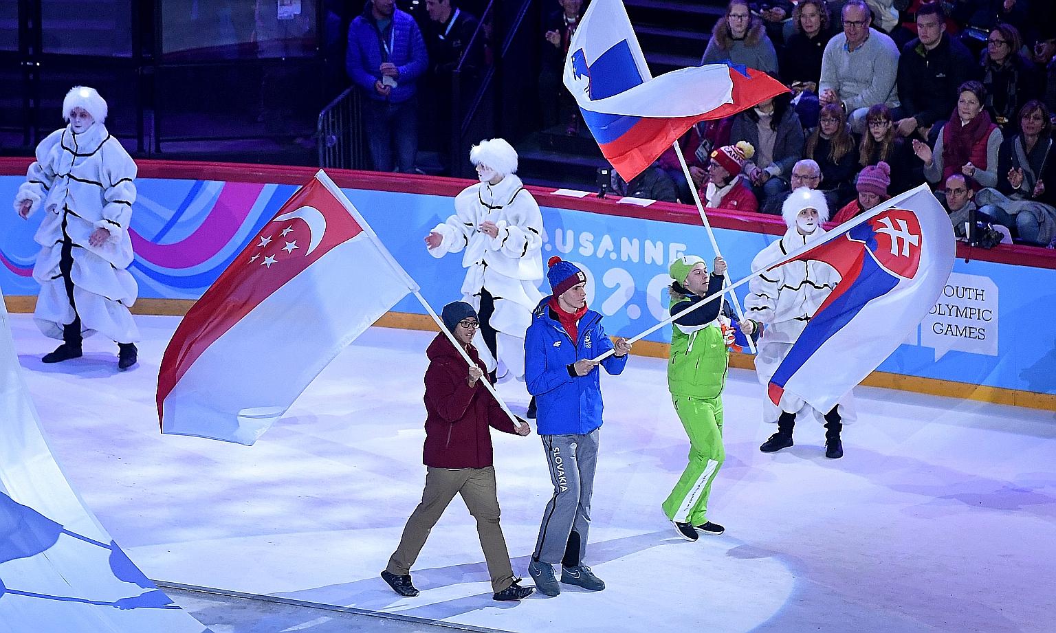 The Winter Youth Olympic Games began in Lausanne, Switzerland, on Thursday, with ice hockey player Matthew Hamnett (far left) representing Singapore at the opening ceremony at the Vaudoise Arena. Two other Singaporeans, short track speed skaters Alys