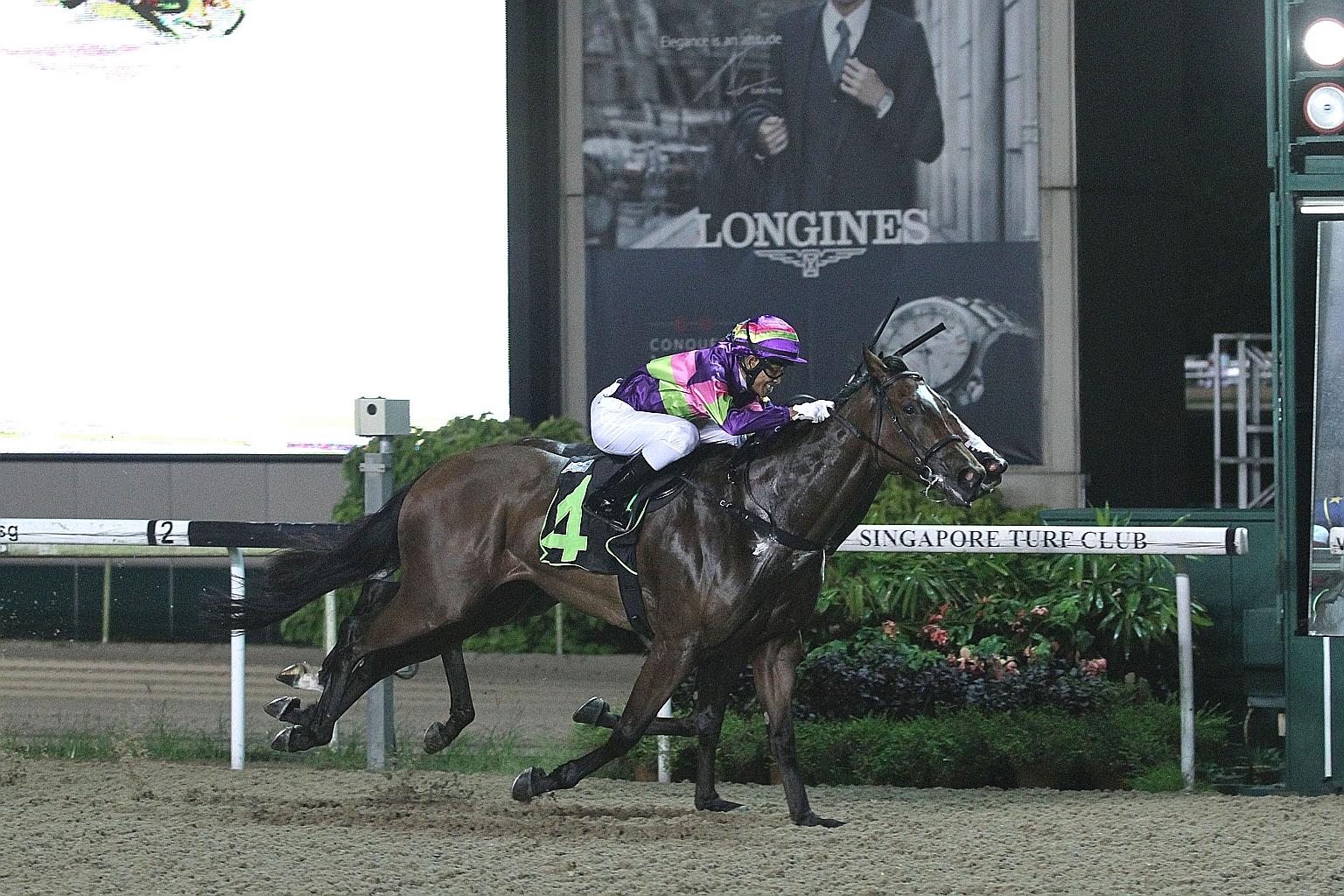 Gingerella winning his battle with Lim's Dream's (obscured) in last night's main event - the $85,000 Class 2 race over the Polytrack 1,000m. ST PHOTOS: SALWA SUANDI