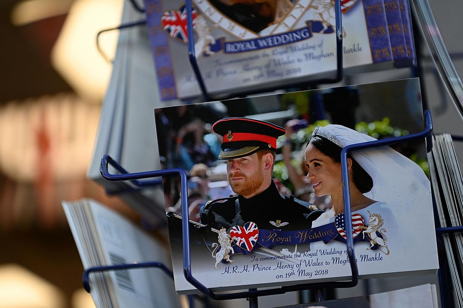 Memorabilia featuring Britain's Prince Harry and his wife Meghan in a store near Buckingham Palace in London. Senior royals were caught off guard by the couple's Wednesday announcement that they were quitting their front-line royal duties.
