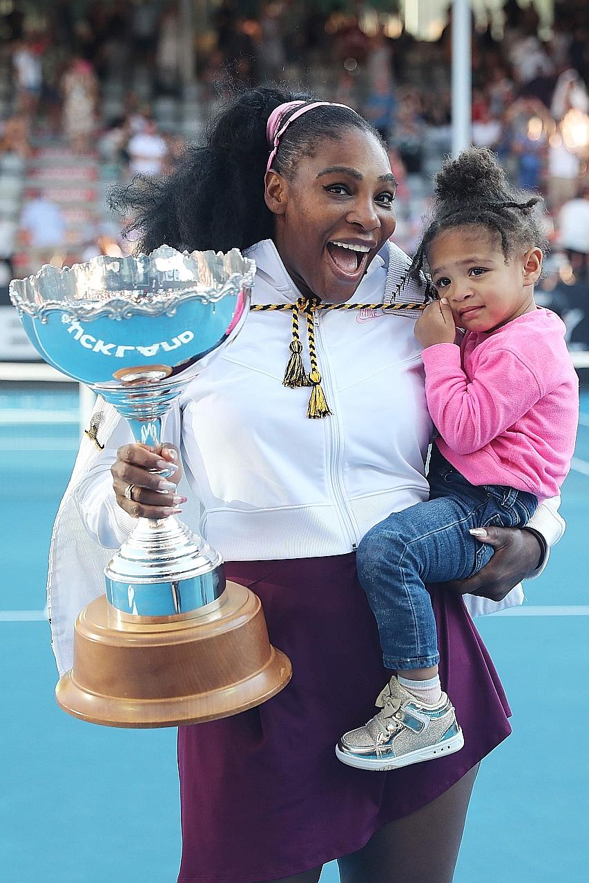 Serena Williams, 38, with her two-year-old daughter Olympia after her win against fellow American Jessica Pegula in yesterday's Auckland Classic final. It was Williams' 73rd career title but the first time she has lifted a trophy since giving birth.