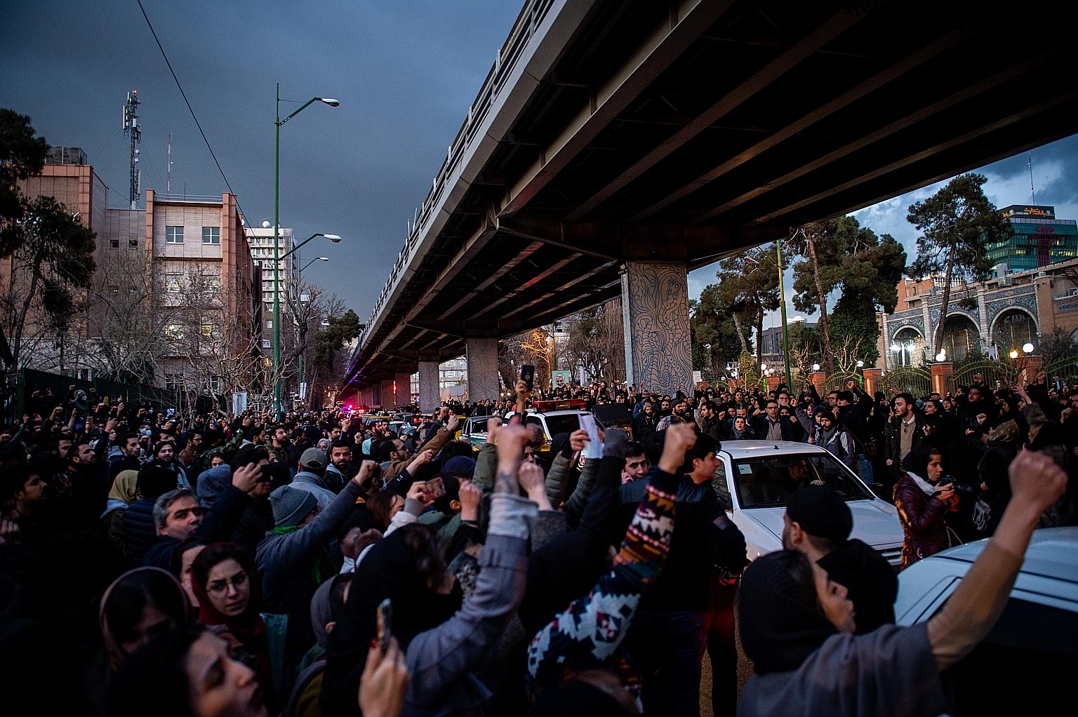 Demonstrators chanting during a vigil in Teheran last Saturday for the victims of the downed Ukraine International Airlines plane. After three days of denials, Teheran admitted early last Saturday that it had "unintentionally" shot down the jet after