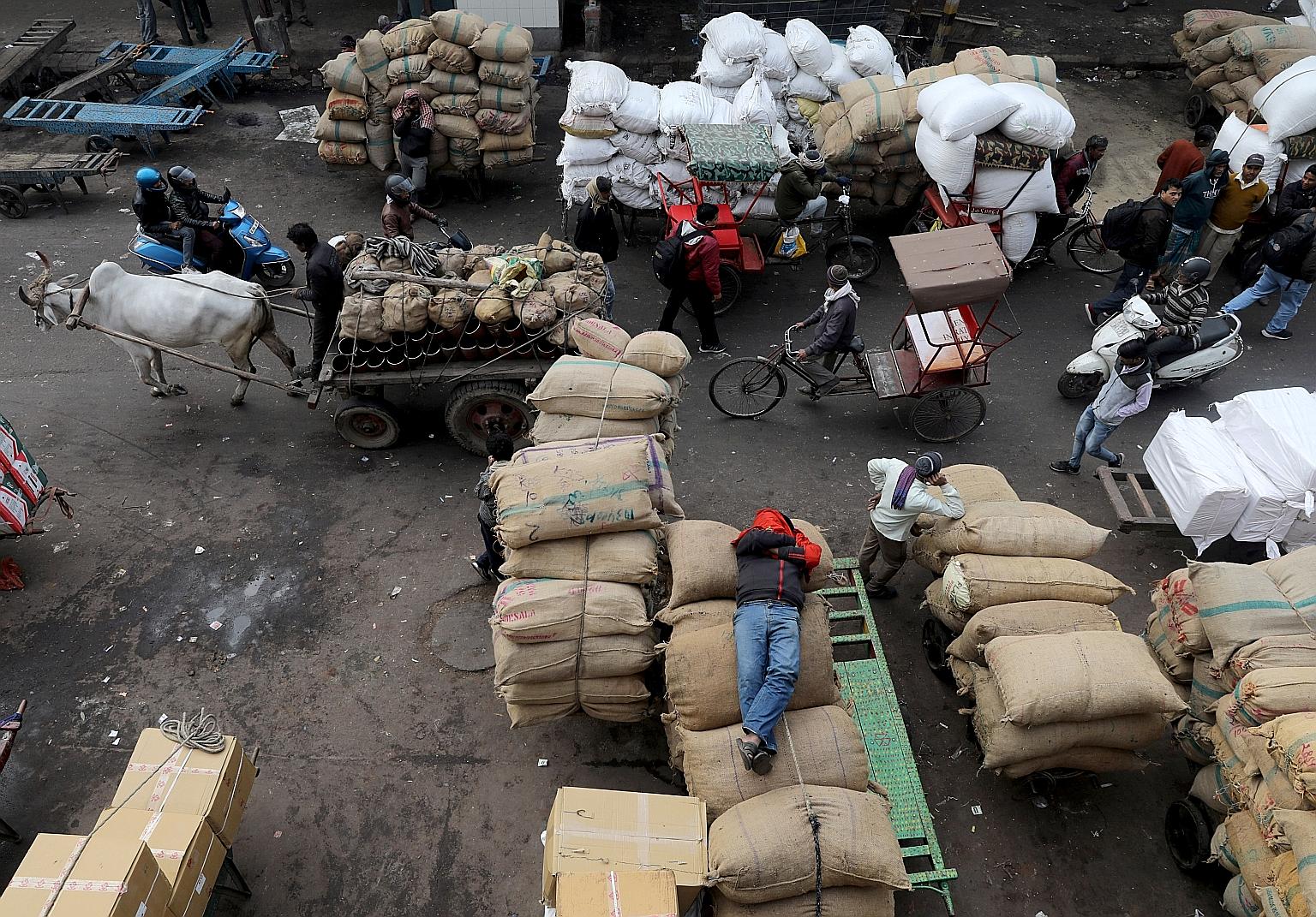 A wholesale market in the old quarters of Delhi on Jan 7. At the heart of India's problems is a slump in consumption following a combination of policy missteps,