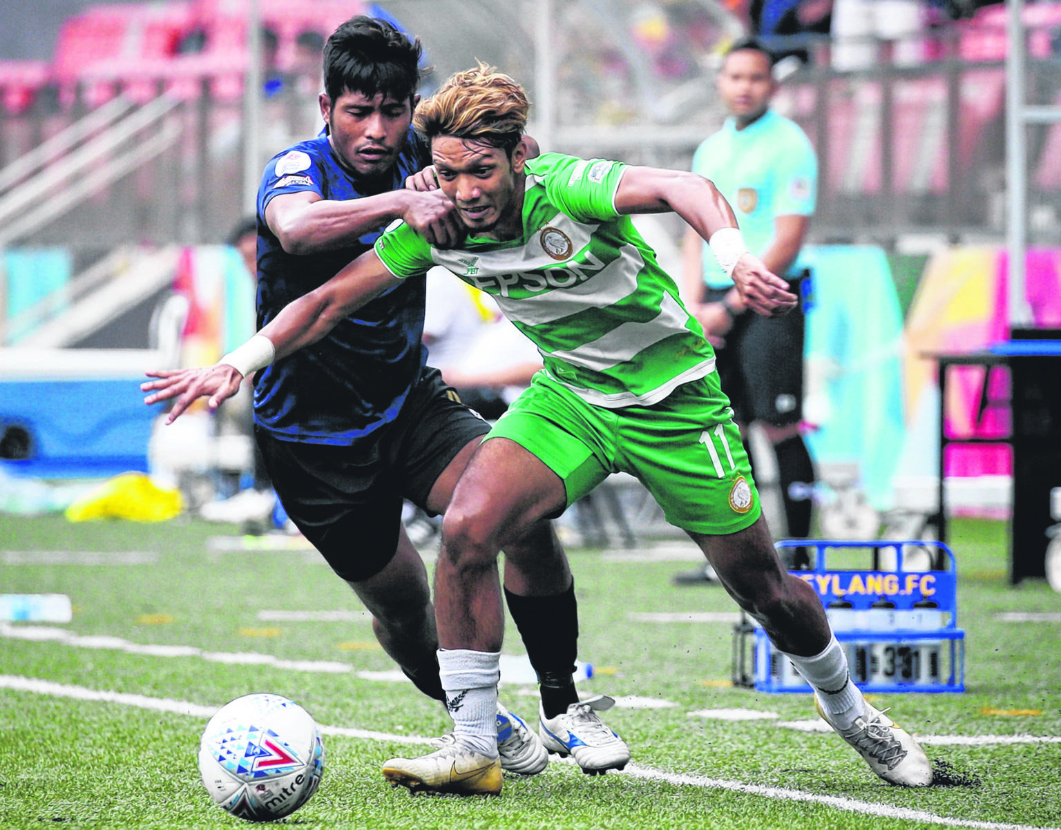 Geylang International's Fareez Farhan (right, fighting for the ball with Hougang United's Afiq Noor) scored nine goals in the Singapore Premier League last year. ST FILE PHOTO