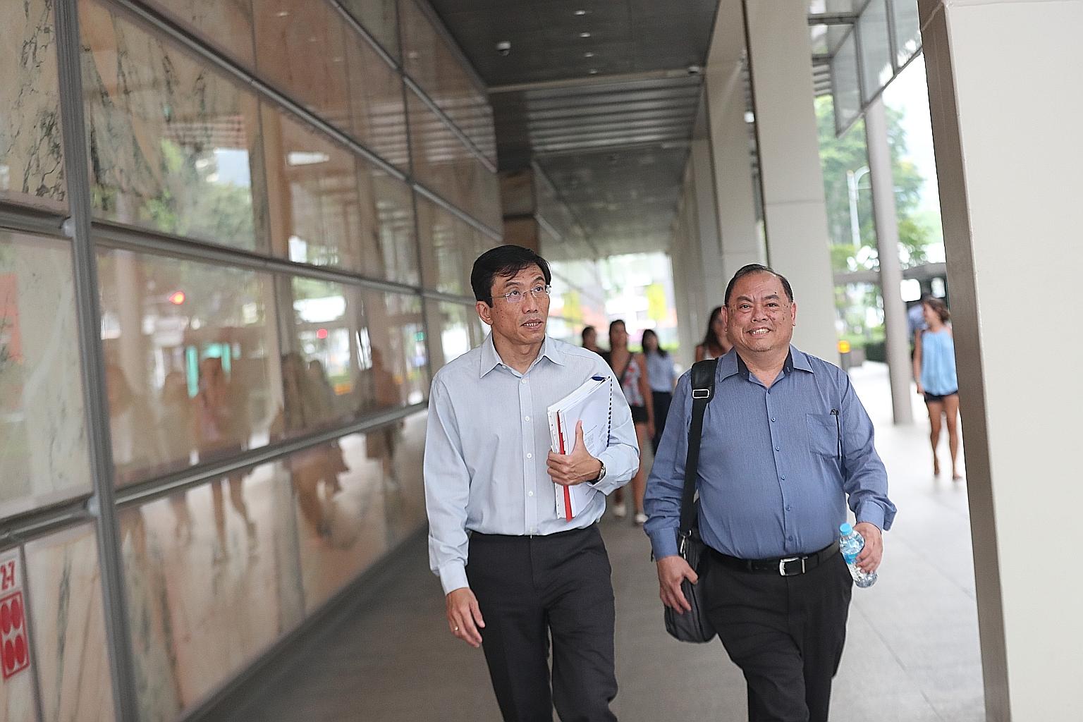 Singapore Democratic Party secretary-general Chee Soon Juan (left) and vice-chairman John Tan leaving the Supreme Court yesterday. The party wants the court to cancel the correction directions it was ordered last month to post alongside its Facebook 