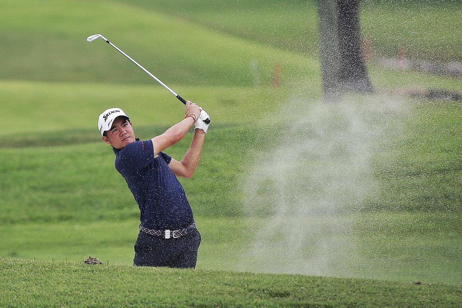 Kosuke Hamamoto of Thailand hitting a bunker shot in his blemish-free six-under 65 which gave him a one-shot lead at the SMBC Singapore Open at Sentosa Golf Club's Serapong Course yesterday.