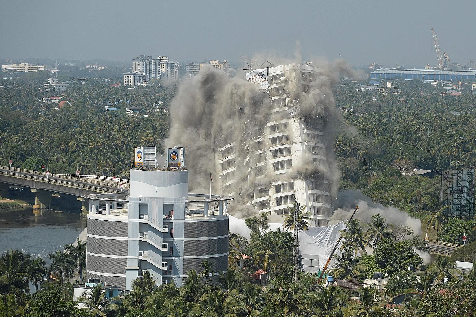 An apartment complex in Kochi, in India's Kerala state, collapsing during a controlled demolition last Saturday ordered by India's Supreme Court. The court found that these high-rise luxury apartment buildings, constructed within 200m of Vembanadu La