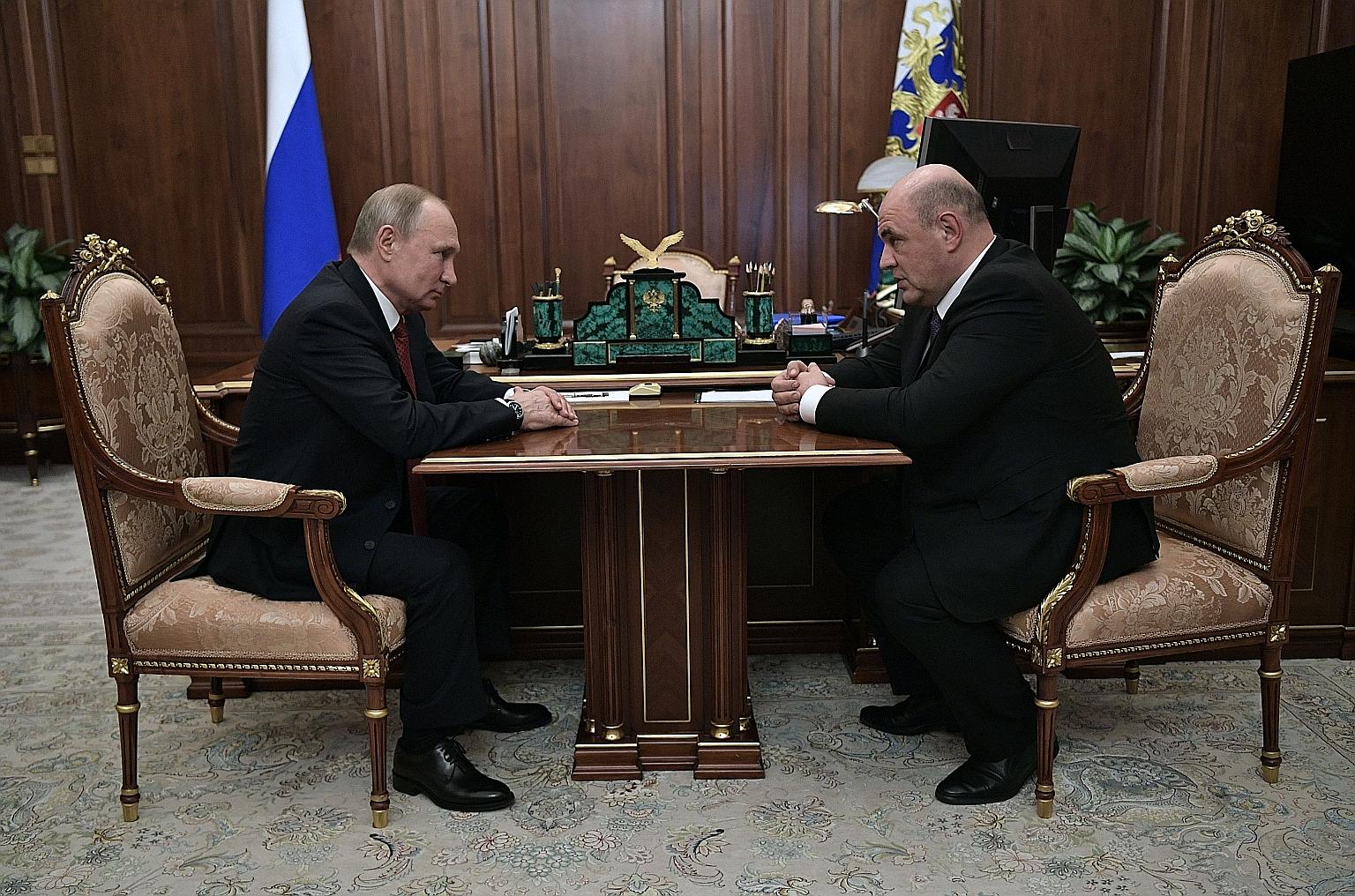 Russian President Vladimir Putin with Mr Mikhail Mishustin, the country's new prime minister, in Moscow on Wednesday. PHOTO: AGENCE FRANCE-PRESSE