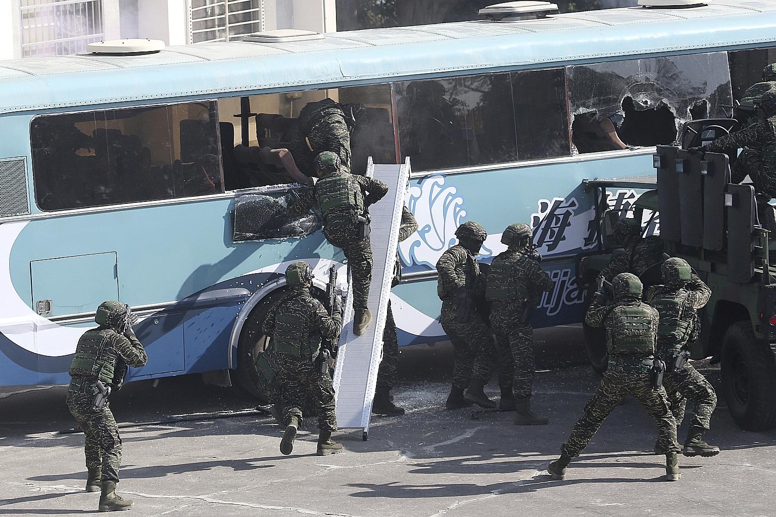 Taiwan's Amphibious Search Team in a military exercise in Kaohsiung yesterday. Even in non-election years, such drills are held in mid-winter to show the military's preparedness to defend Taiwan over Chinese New Year. PHOTO: ASSOCIATED PRESS