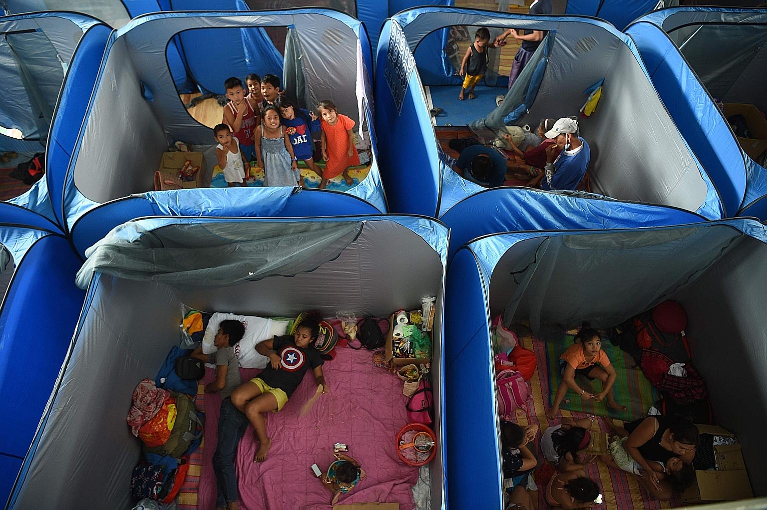 Residents affected by the eruption of Taal volcano staying at an evacuation centre in Tagaytay city, in the Philippines. PHOTO: AGENCE FRANCE-PRESSE