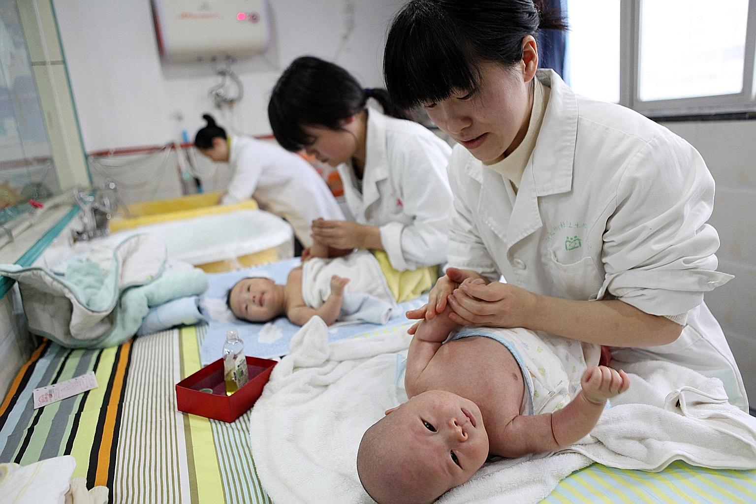 China has struggled to arrest the country's declining birth rate for years, including easing its stringent one-child policy. Researchers have forecast that the country's total population will begin to decline around 2028. PHOTO: AGENCE FRANCE-PRESSE