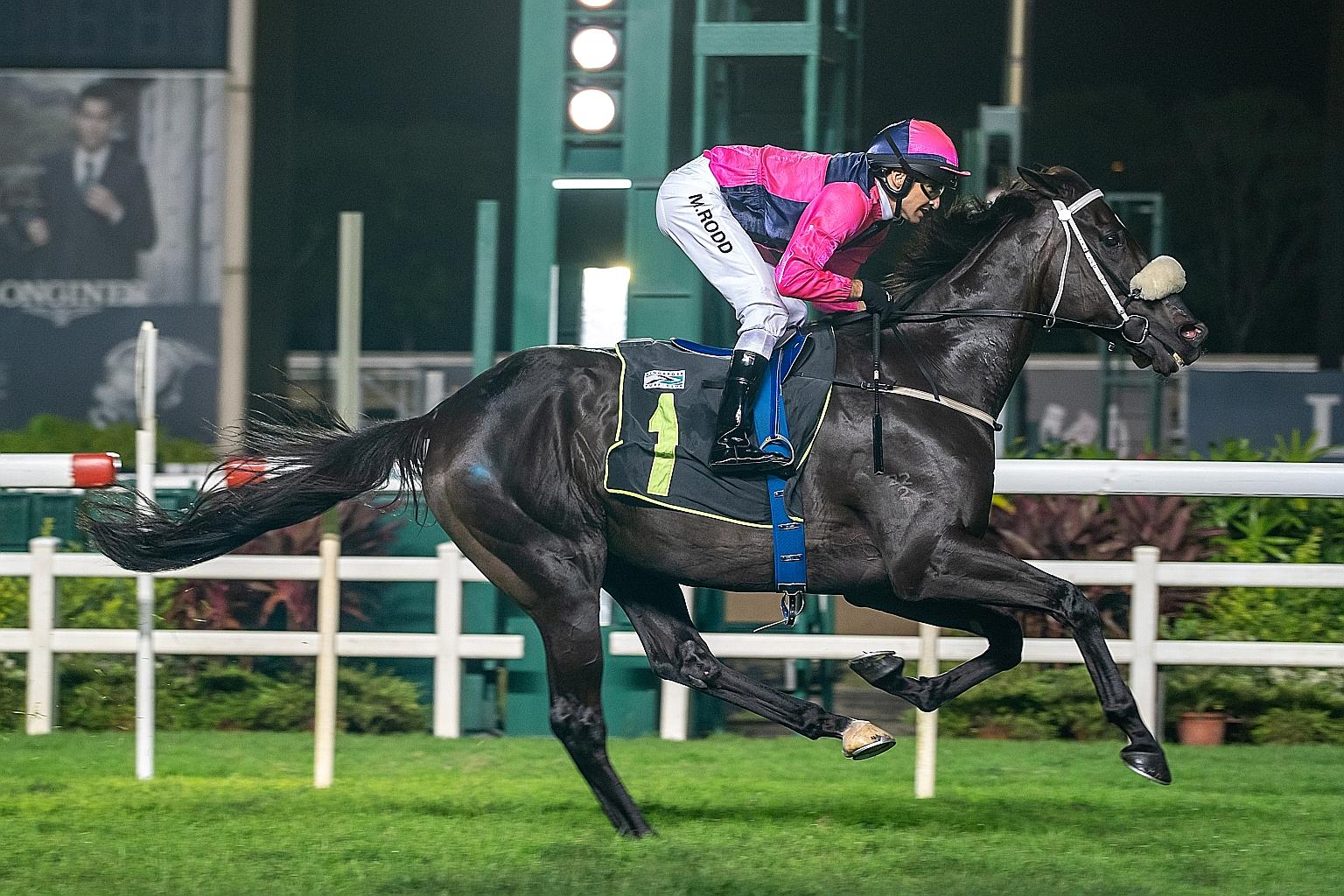 Jockey Michael Rodd guiding $20 chance Mighty Kenny to an easy all-the-way win in last night's staying race for Class 4 horses over 2,000m at Kranji.