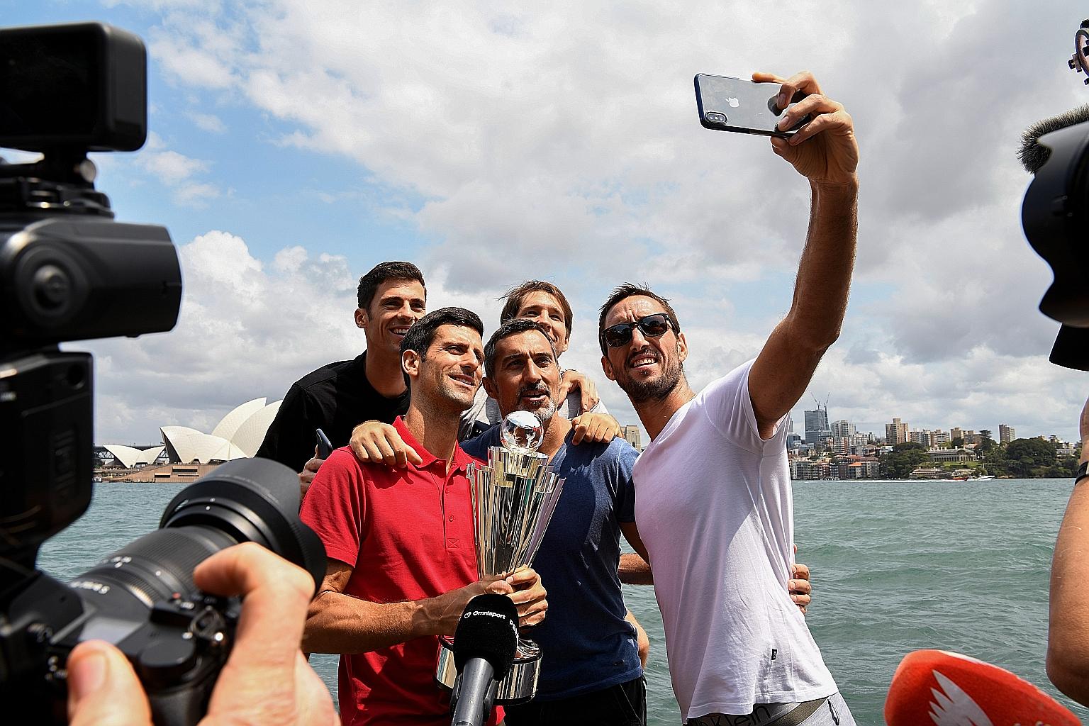 Novak Djokovic (in red) and the rest of the Serbia team posing for a wefie with the ATP Cup in Sydney. Australia has been a happy hunting ground for the 32-year-old.